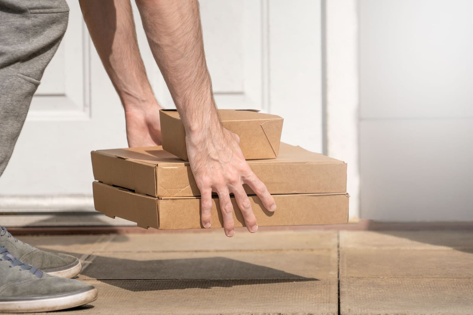 Cardboard delivery packages left at a front door