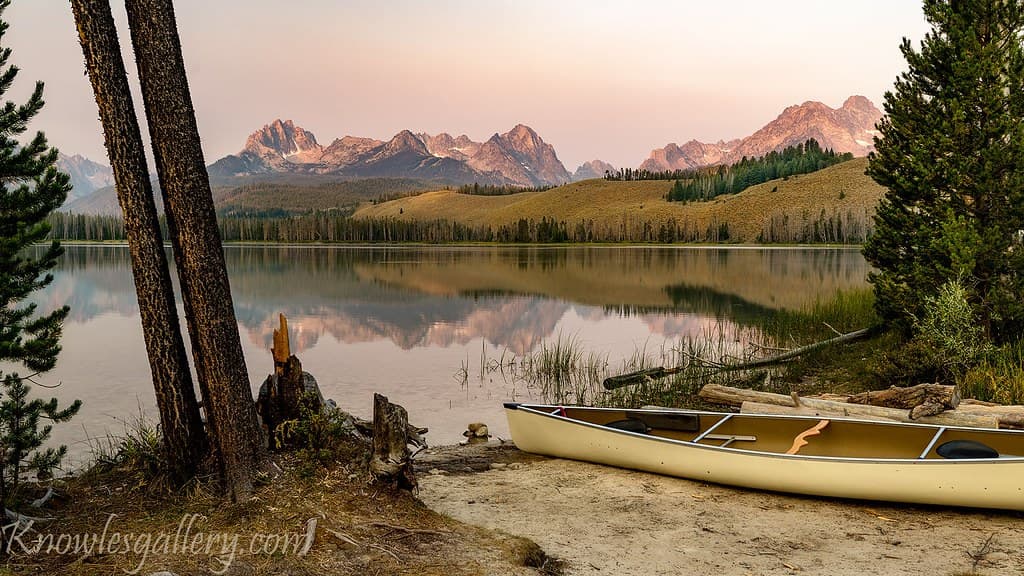 Canoes stored on racks beside Lake of the Isles