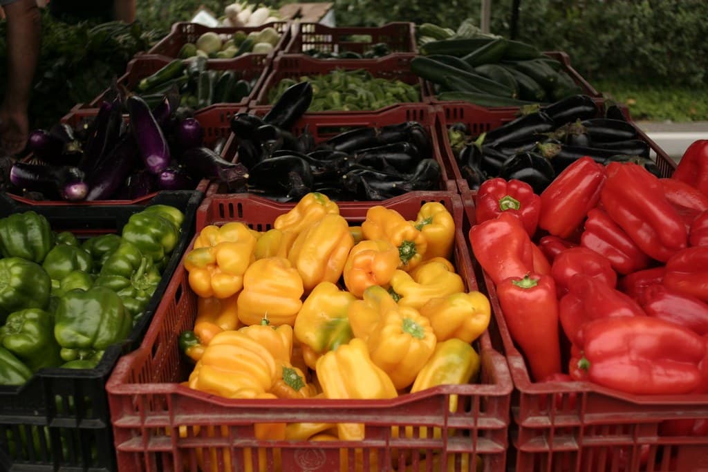 Produce stalls at an outdoor farmers market