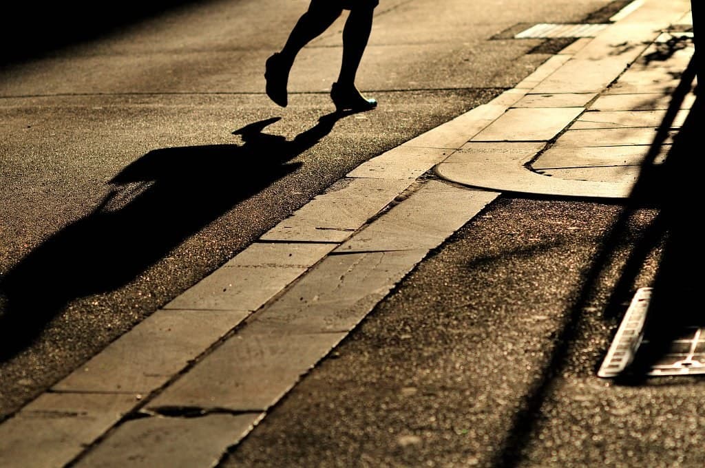 Pedestrians and a bus stop along a walkable city street