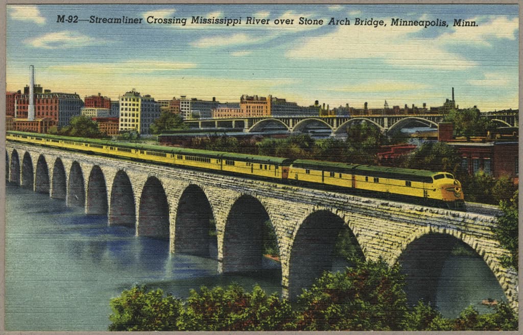 'Streamliner Crossing Mississippi River over Stone Arch Bridge, Minneapolis, Minn.' / postcard